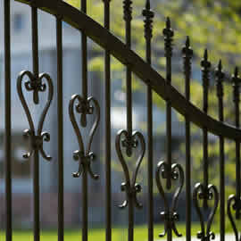 Wrought iron tracery black fence